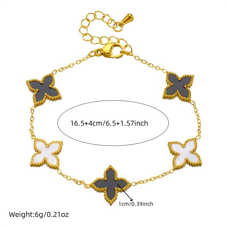 Korean style light luxury black and white double-sided reversible four-leaf clover necklace, simple and unique bracelet, fashionable and versatile jewelry set.