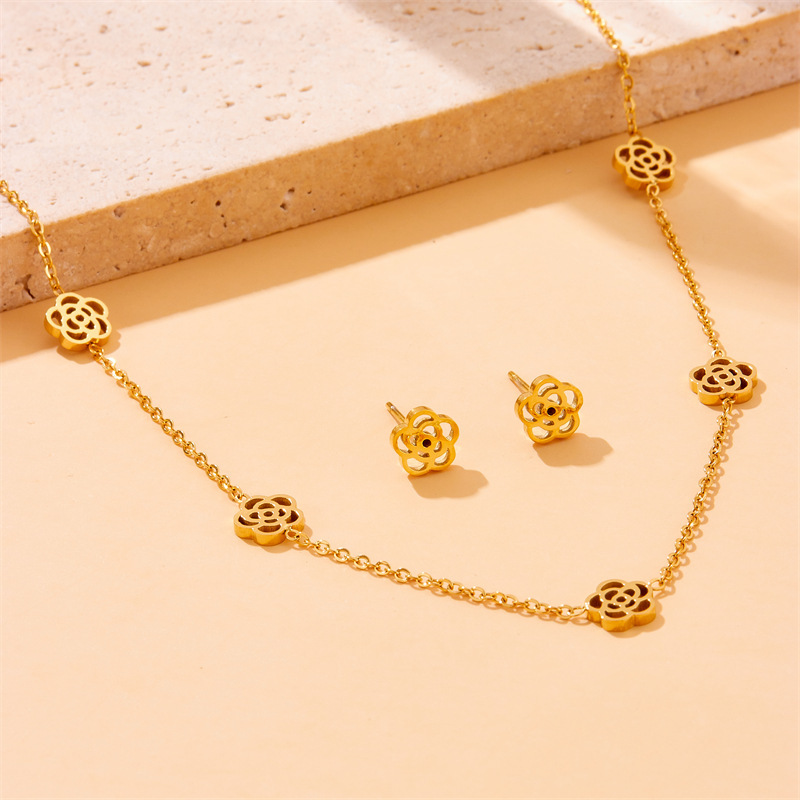 European and American style niche versatile glossy hollow rose accessory chain stainless steel necklace, earrings, and bracelet set