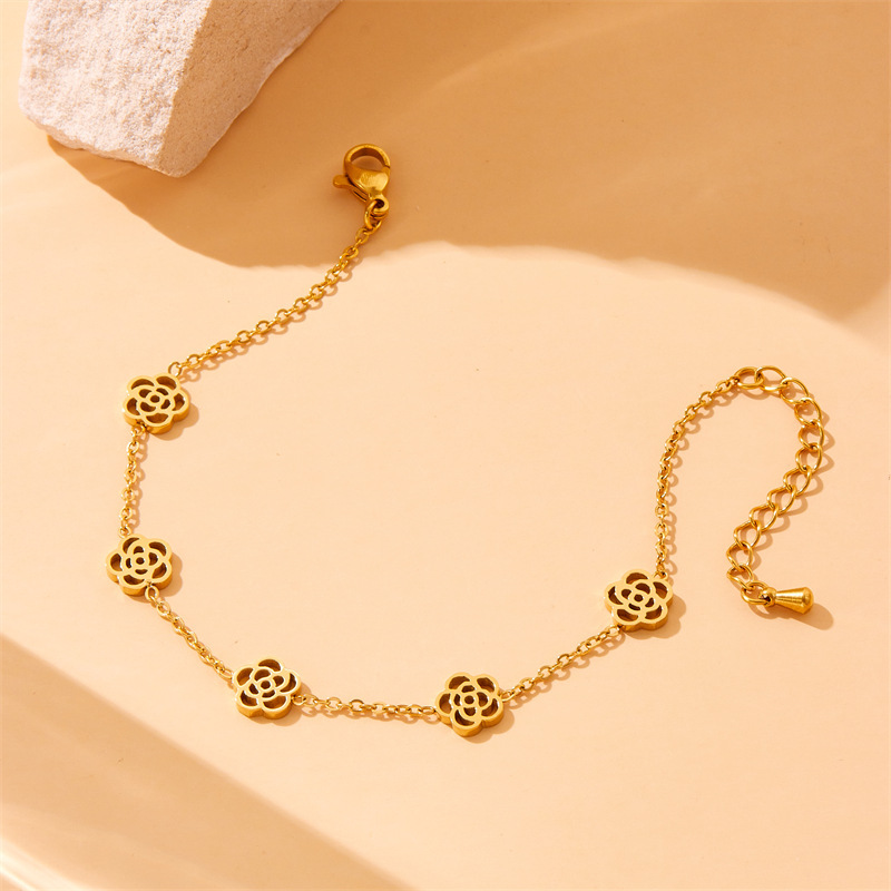 European and American style niche versatile glossy hollow rose accessory chain stainless steel necklace, earrings, and bracelet set