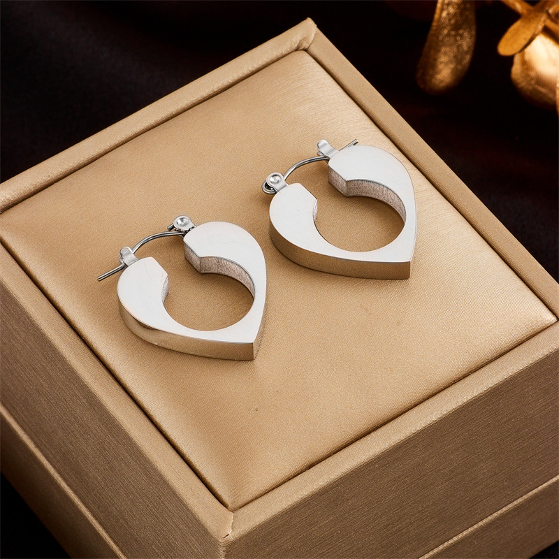 Korean style minimalist niche high-end cool minimalist design hollow heart titanium steel metal versatile earrings