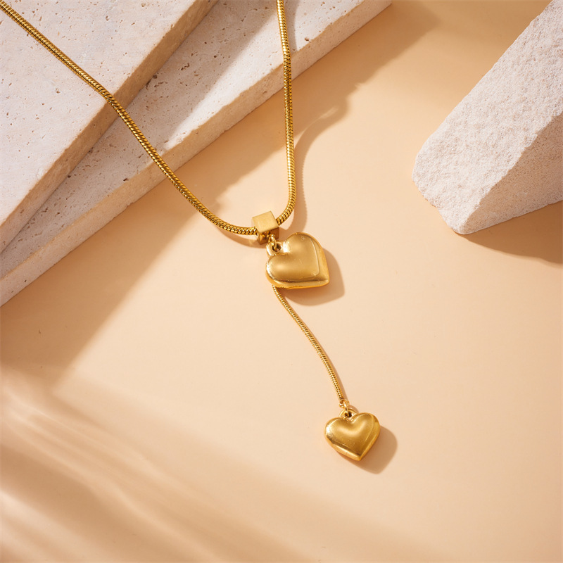 Cross-border fashion minimalist metal high-end cool style heart pendant tassel chain stainless steel gold-plated necklace