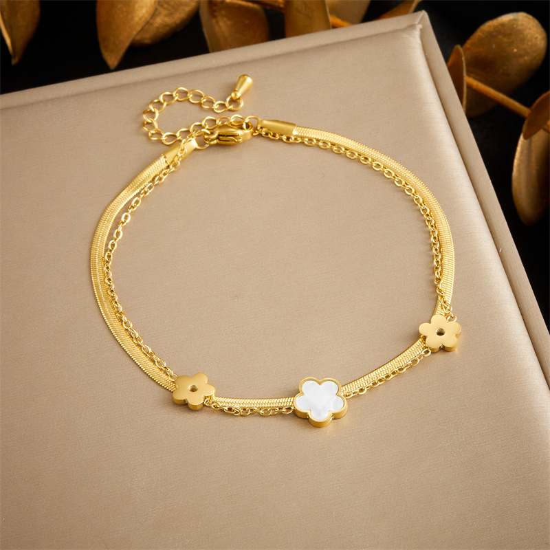 Stylish, niche, minimalist, elegant white seashell, butterfly, and flower accessory chain; multi-layered stainless steel anklet.