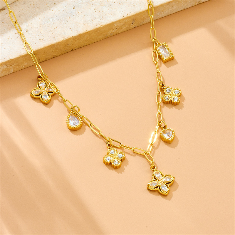 French retro-chic, light luxury, high-end diamond-encrusted teardrop-shaped four-petal flower pendant chain stainless steel clavicle necklace