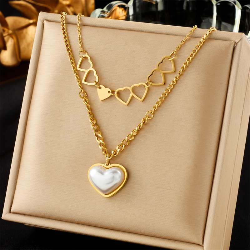 New fashionable and unique multi-layered clavicle chain necklace with pearl, butterfly, heart, and portrait pendants.