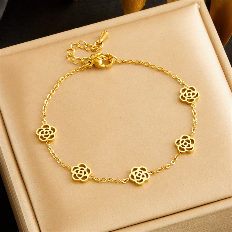 European and American style niche versatile glossy hollow rose accessory chain stainless steel necklace, earrings, and bracelet set