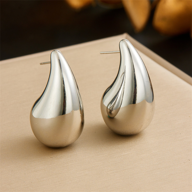 Bestselling European and American style stainless steel hollow smooth teardrop bracelet, stainless steel material, gold and silver comma-shaped open set