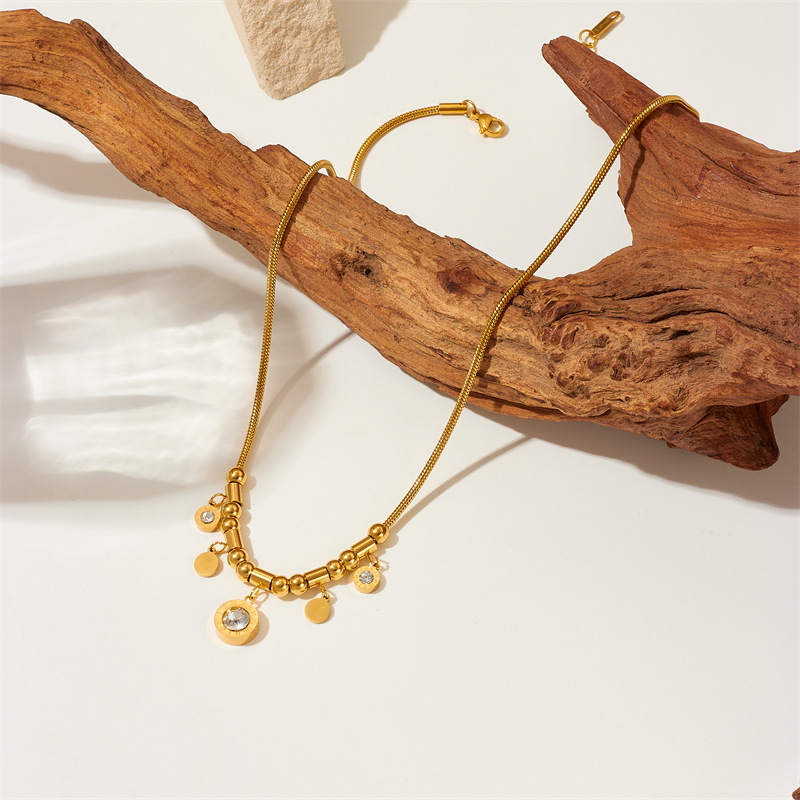 Stylish, edgy, retro punk-inspired, gold-plated stainless steel Roman numeral round pendant chain necklace