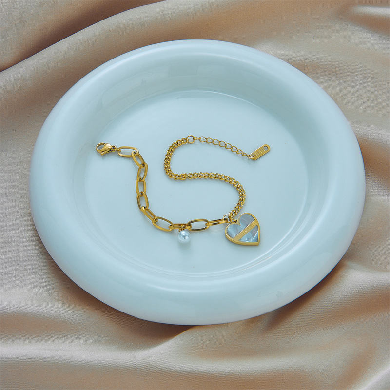 European and American cross-border niche design fashionable high-end retro irregular titanium steel chain pearl heart pendant bracelet