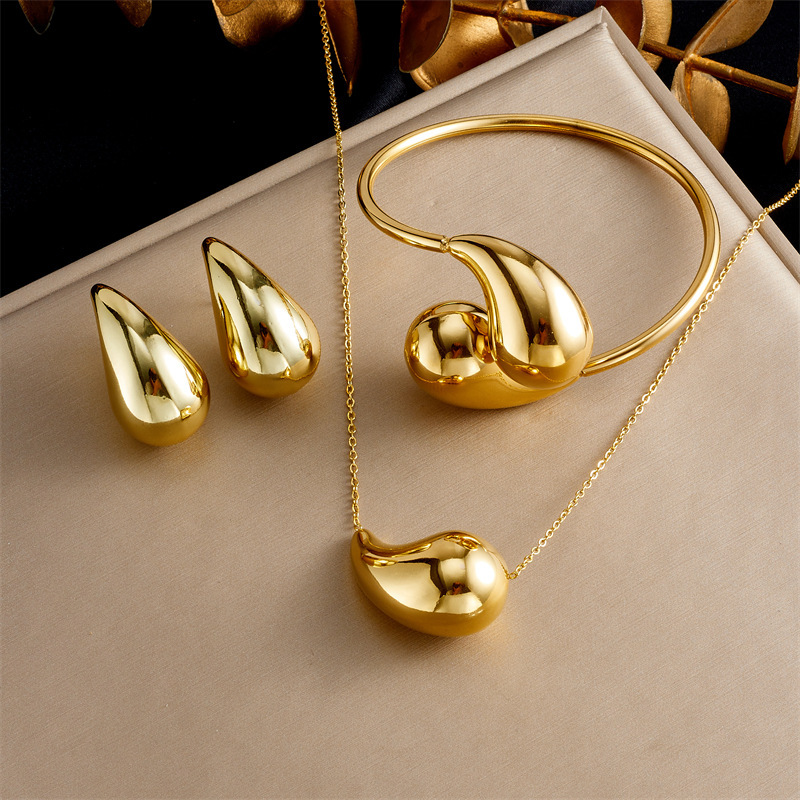 European and American style, high-end, gold-plated hollow teardrop pendant stainless steel earrings, bracelets, and necklace set