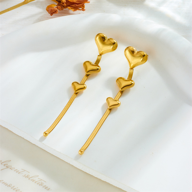 European and American fashion niche design long chain tassel heart accessory titanium steel gold-plated earrings