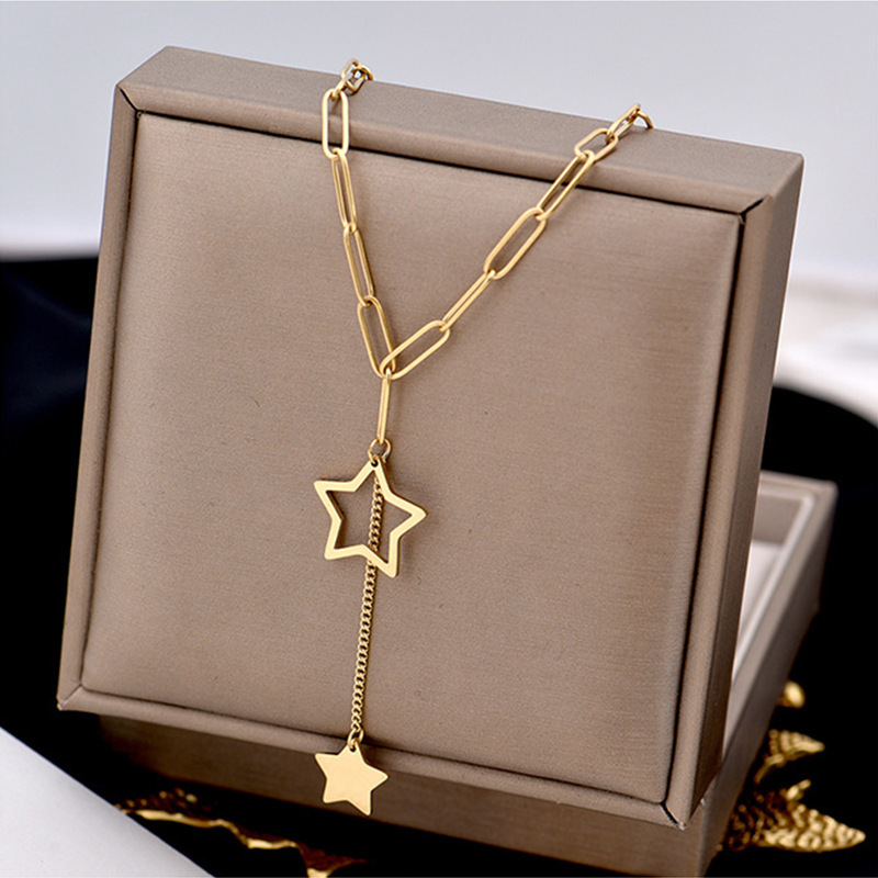 Korean style minimalist and elegant hollowed-out five-pointed star tassel pendant titanium steel necklace, fashionable and versatile, unique clavicle chain.