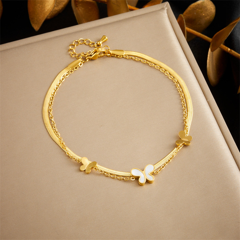 Stylish, niche, minimalist, elegant white seashell, butterfly, and flower accessory chain; multi-layered stainless steel anklet.