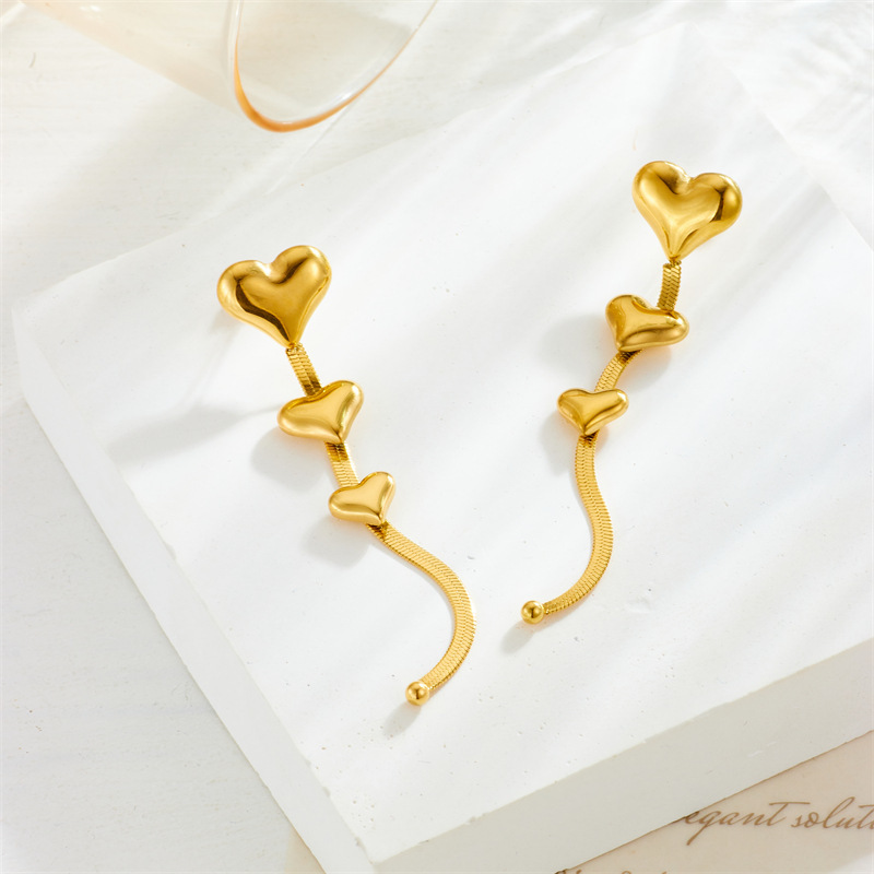 European and American fashion niche design long chain tassel heart accessory titanium steel gold-plated earrings