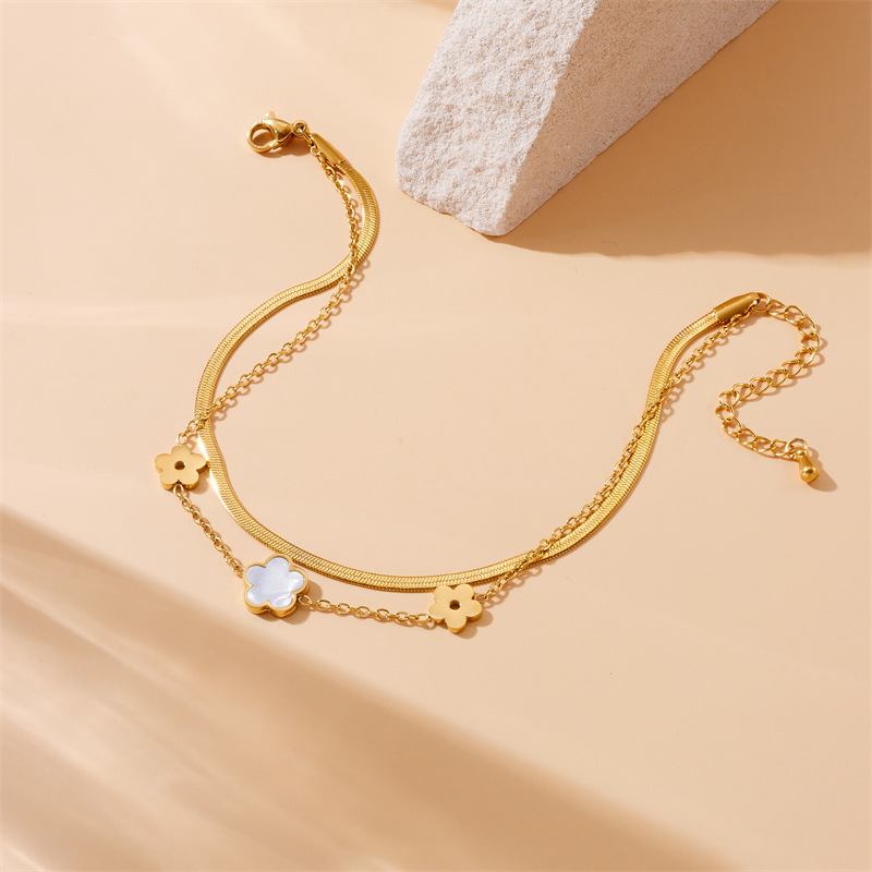 Stylish, niche, minimalist, elegant white seashell, butterfly, and flower accessory chain; multi-layered stainless steel anklet.