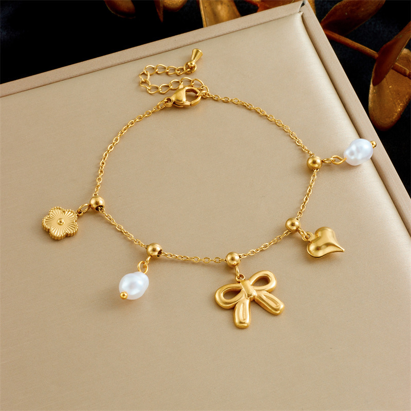 Stylish and versatile new bow pearl heart drop color-blocked elephant accessory stainless steel chain bracelet