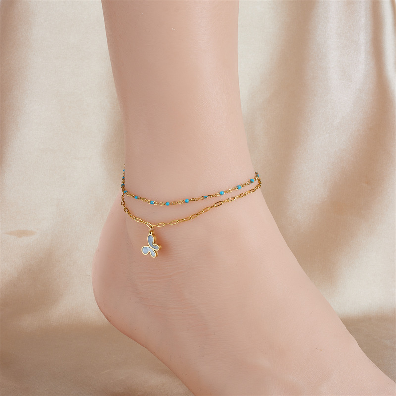 Fashionable, retro, simple, versatile, double-layered, turquoise, gold-plated chain, stainless steel butterfly and flower pendant anklet.
