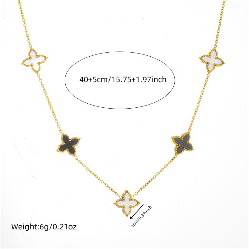 Korean style light luxury black and white double-sided reversible four-leaf clover necklace, simple and unique bracelet, fashionable and versatile jewelry set.