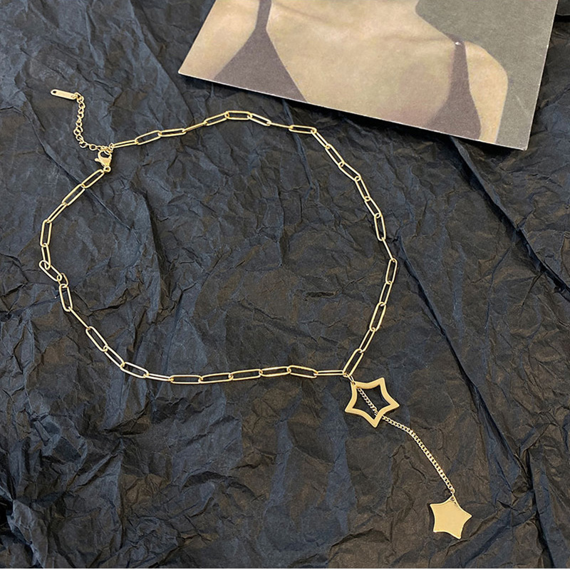 Korean style minimalist and elegant hollowed-out five-pointed star tassel pendant titanium steel necklace, fashionable and versatile, unique clavicle chain.