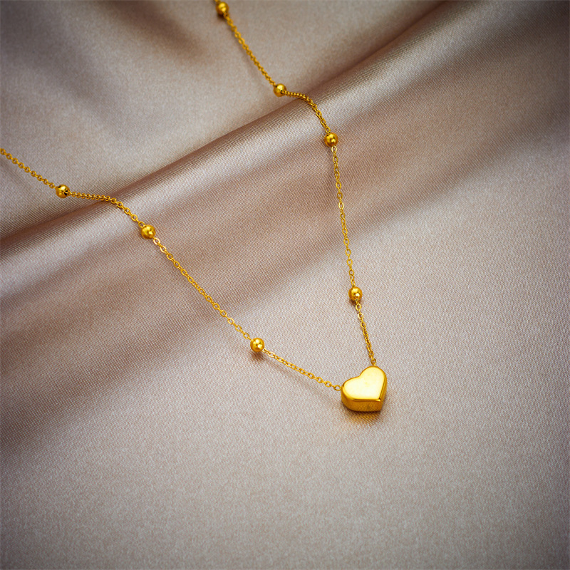 Stylish, versatile, and easy to match, this heart-shaped pendant necklace/bracelet set is perfect for everyday wear and is made of titanium steel.