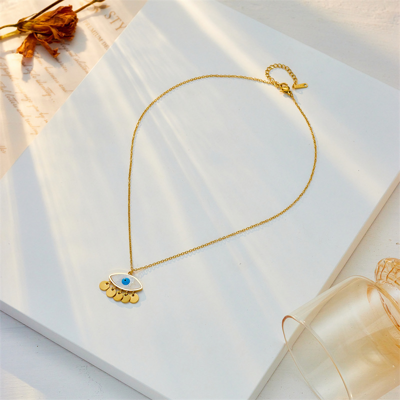 European and American style, unique and fashionable, creative niche design, round tassel oval blue eye pendant stainless steel chain necklace