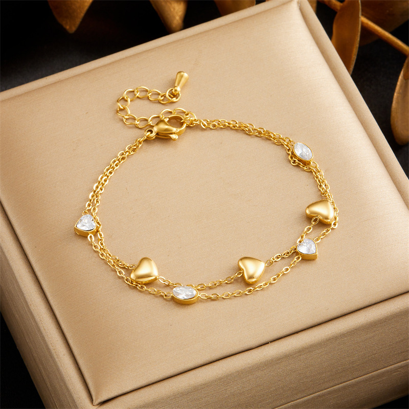 European and American style minimalist design, rhinestone-encrusted oval heart and flower pattern, polished stainless steel gold-plated chain, double-layer bracelet.