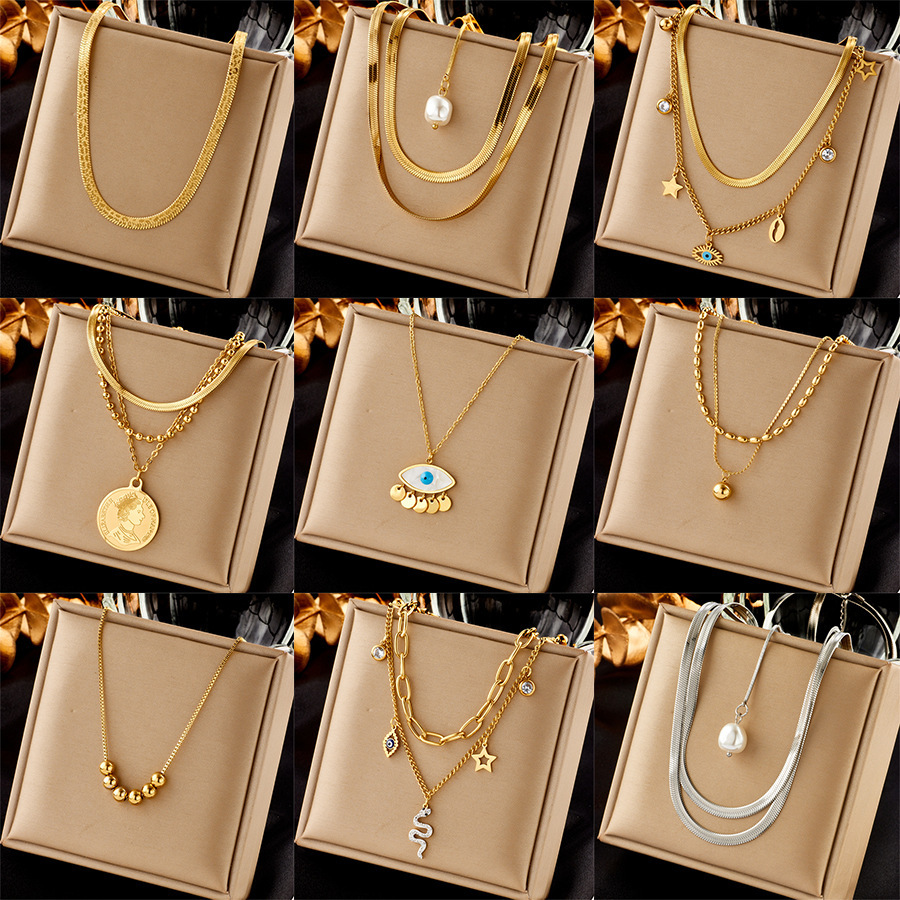 Fashionable, niche, minimalist design, metal titanium steel jewelry, versatile clavicle chain, pearl round pendant, eye-shaped necklace.