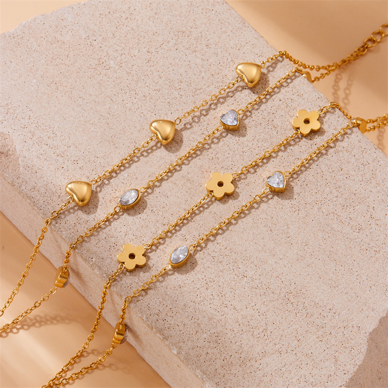 European and American style minimalist design, rhinestone-encrusted oval heart and flower pattern, polished stainless steel gold-plated chain, double-layer bracelet.