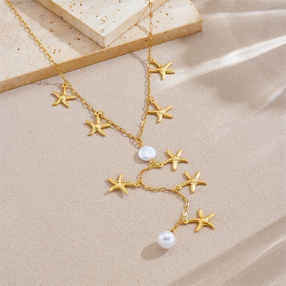 Stylish, versatile, minimalist, irregular Y-shaped chain with gold-plated pearl, starfish, and stainless steel pendant tassel necklace.