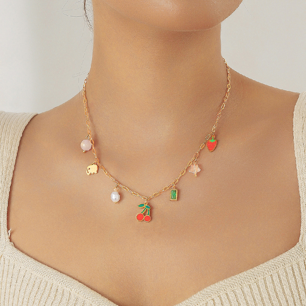 Fashionable, sweet, fresh, and pastoral style stainless steel necklace with multi-element pearl fruit pendant featuring cherry and strawberry designs.