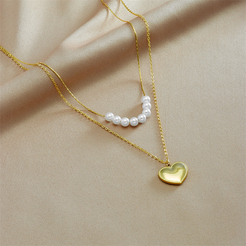 New European and American style light luxury double-layer pearl three-dimensional heart pendant necklace, elegant and simple clavicle chain