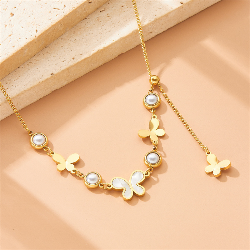 Cross-border fashion retro round pearl polished white mother-of-pearl butterfly accessory pendant tassel chain stainless steel necklace