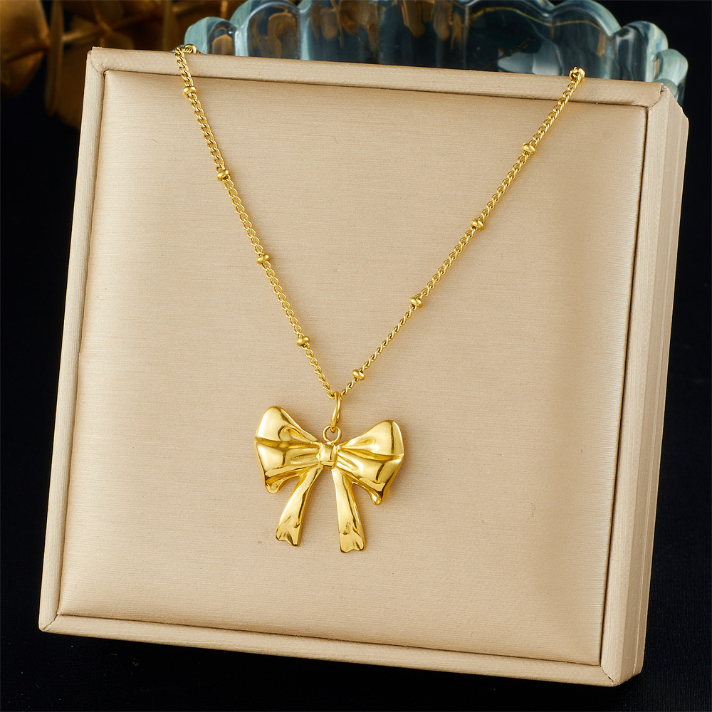 Cross-border fashion gold-plated retro creative multi-element pendant hollow starfish bow flower sun crab necklace