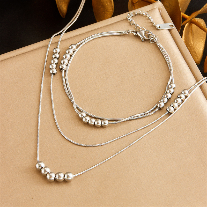 European and American style, simple and versatile, double-layered, beaded chain stainless steel jewelry set, bracelet and necklace.