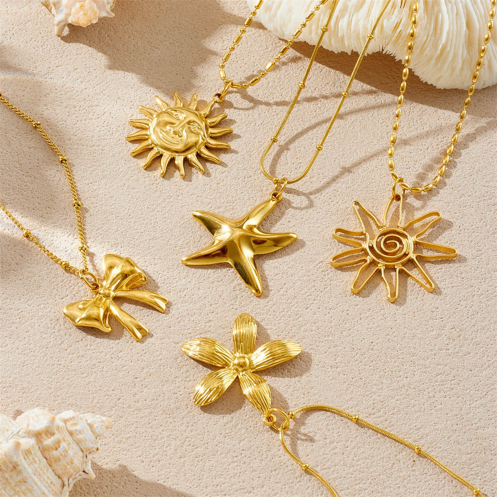 Cross-border fashion gold-plated retro creative multi-element pendant hollow starfish bow flower sun crab necklace