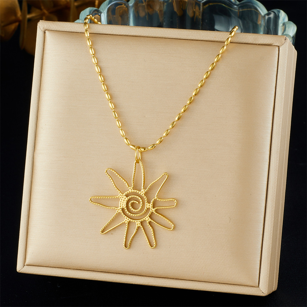 Cross-border fashion gold-plated retro creative multi-element pendant hollow starfish bow flower sun crab necklace