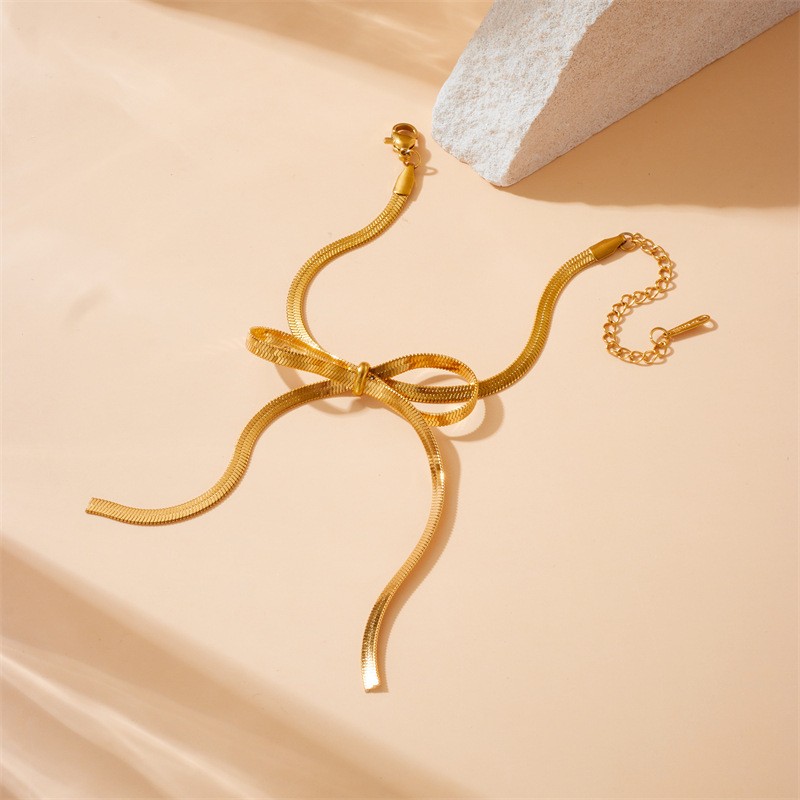 Cross-border fashion minimalist design gold-plated stainless steel bow snake chain accessory bracelet