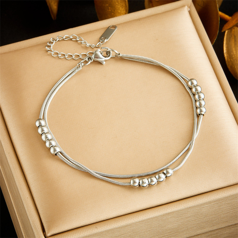 European and American style, simple and versatile, double-layered, beaded chain stainless steel jewelry set, bracelet and necklace.