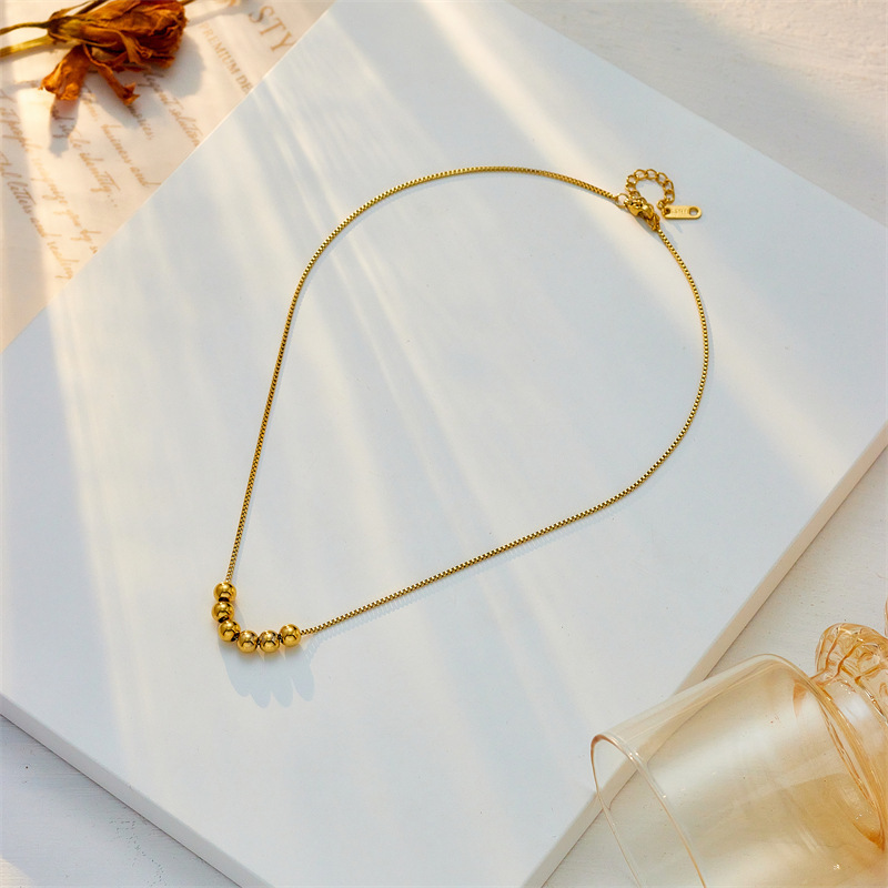 Korean style, simple and fashionable, unique gold round beaded titanium steel chain necklace with niche design.