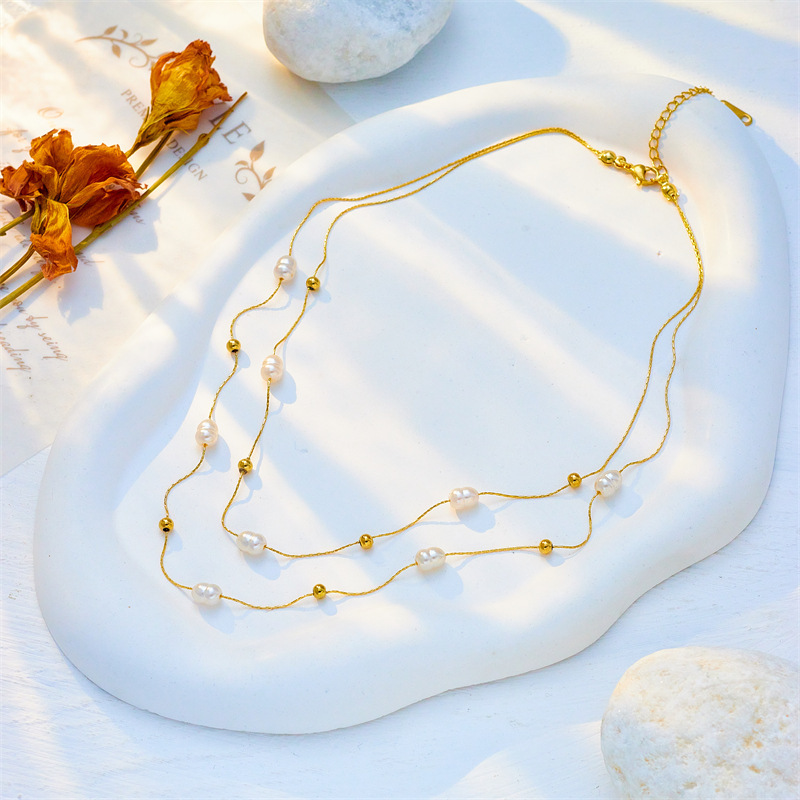 European and American minimalist, elegant, retro, versatile gold round pearl delicate chain double-layer titanium steel clavicle necklace