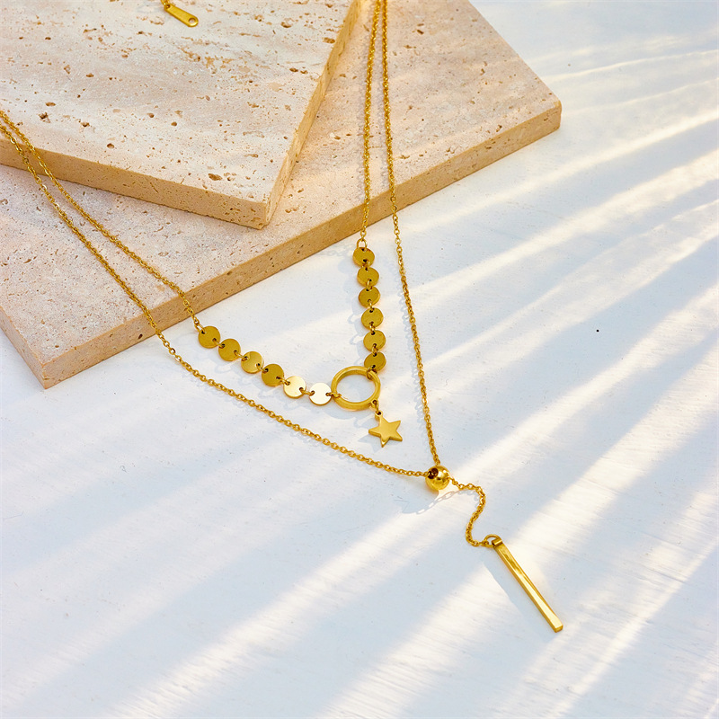 Double-layered, minimalist, elegant tassel necklace with titanium steel circle and star pendant.