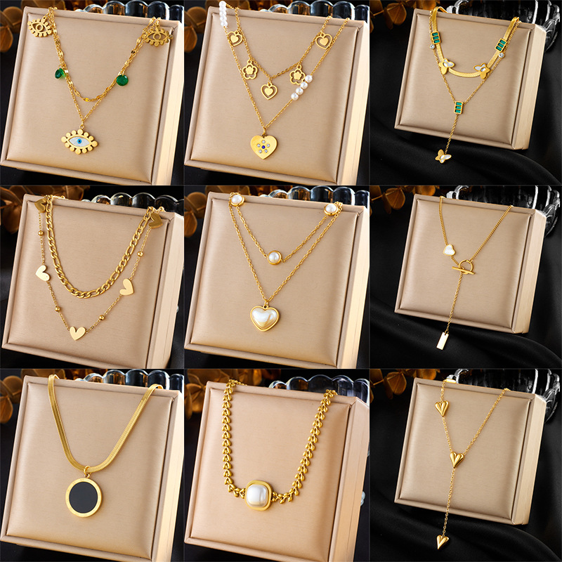 European and American style niche retro high-end gold-plated stainless steel pearl heart eye butterfly pendant multi-layer necklace