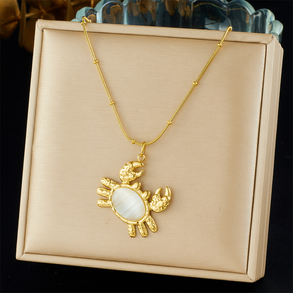 Cross-border fashion gold-plated retro creative multi-element pendant hollow starfish bow flower sun crab necklace