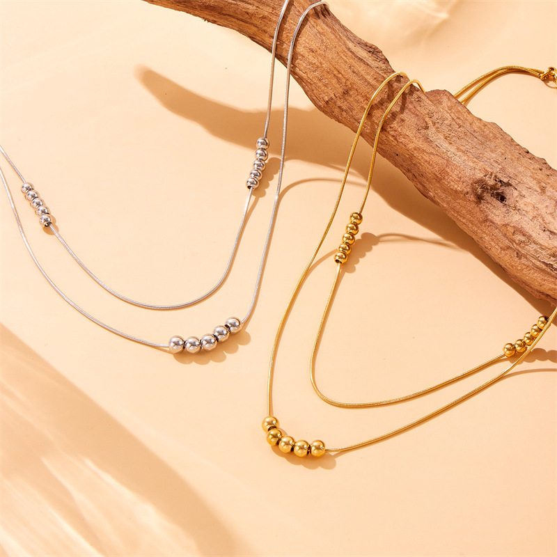 European and American style, simple and versatile, double-layered, beaded chain stainless steel jewelry set, bracelet and necklace.