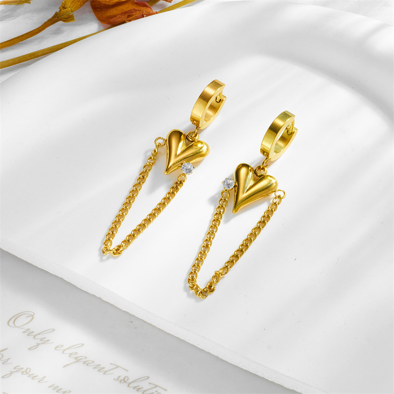 Stylish, sophisticated, and luxurious long chain earrings with diamond-encrusted heart pendant, gold-plated titanium steel.
