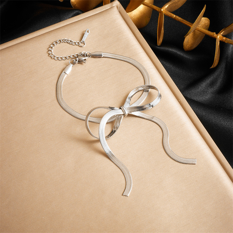 Cross-border fashion minimalist design gold-plated stainless steel bow snake chain accessory bracelet