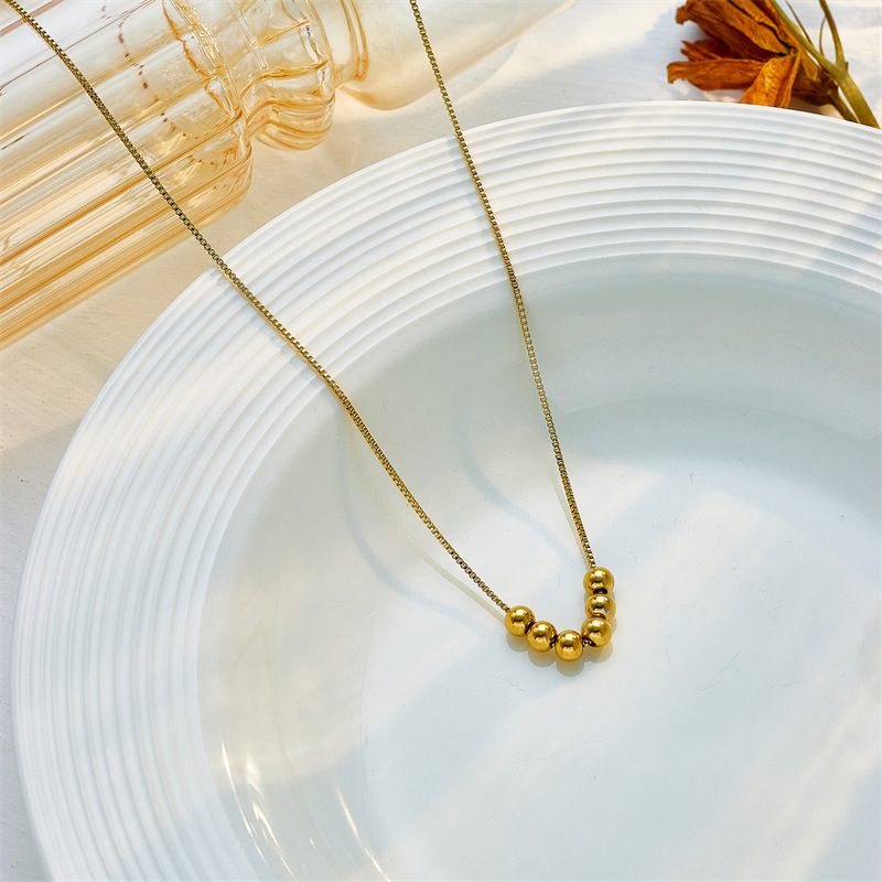 Korean style, simple and fashionable, unique gold round beaded titanium steel chain necklace with niche design.