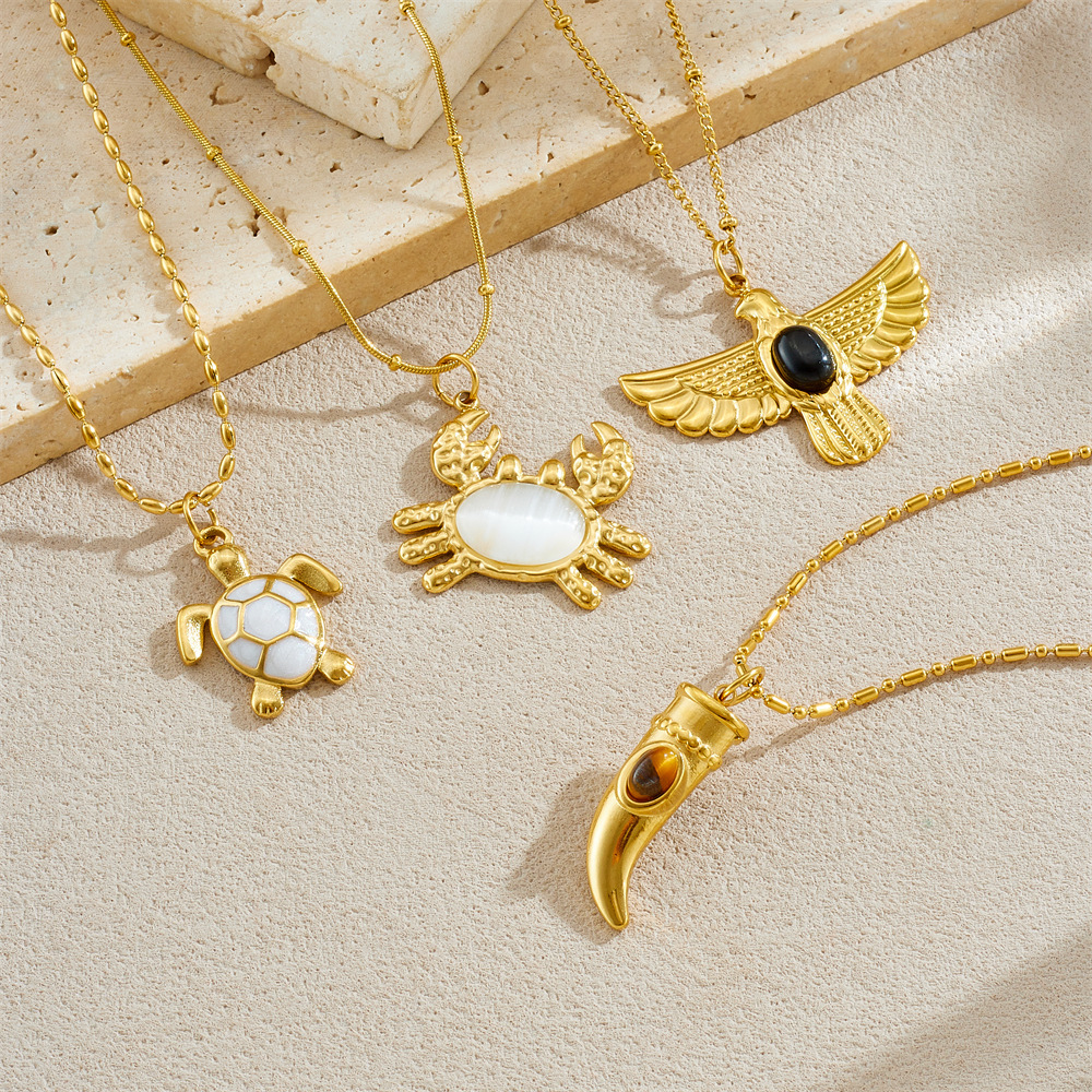 Cross-border fashion gold-plated retro creative multi-element pendant hollow starfish bow flower sun crab necklace
