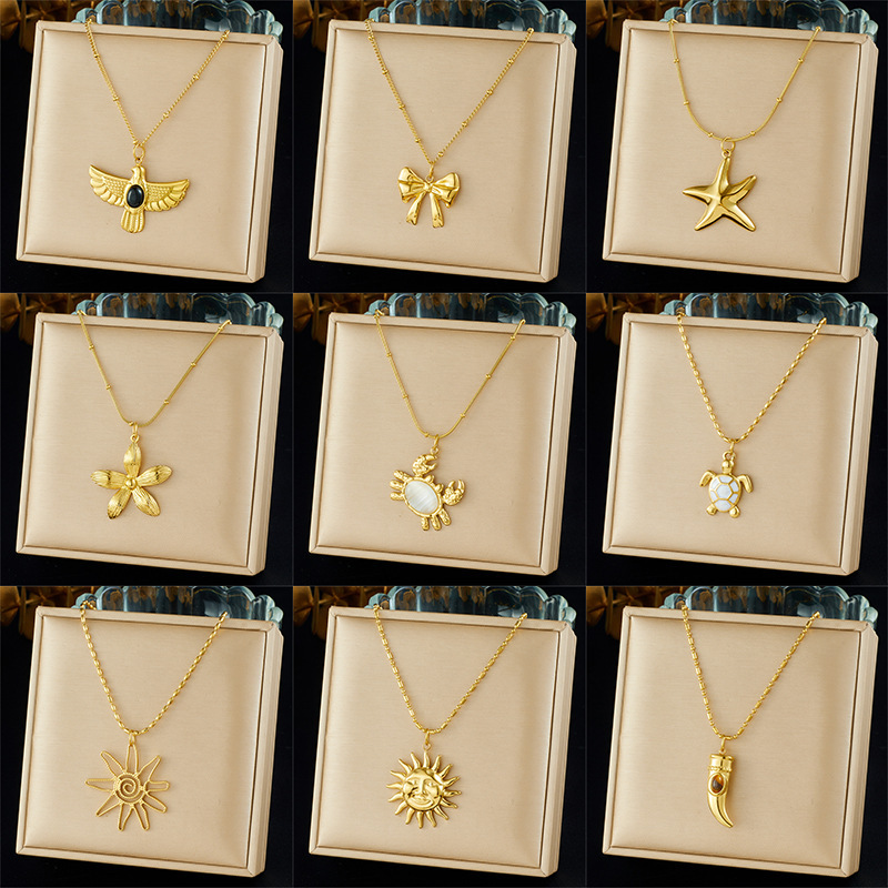 Cross-border fashion gold-plated retro creative multi-element pendant hollow starfish bow flower sun crab necklace