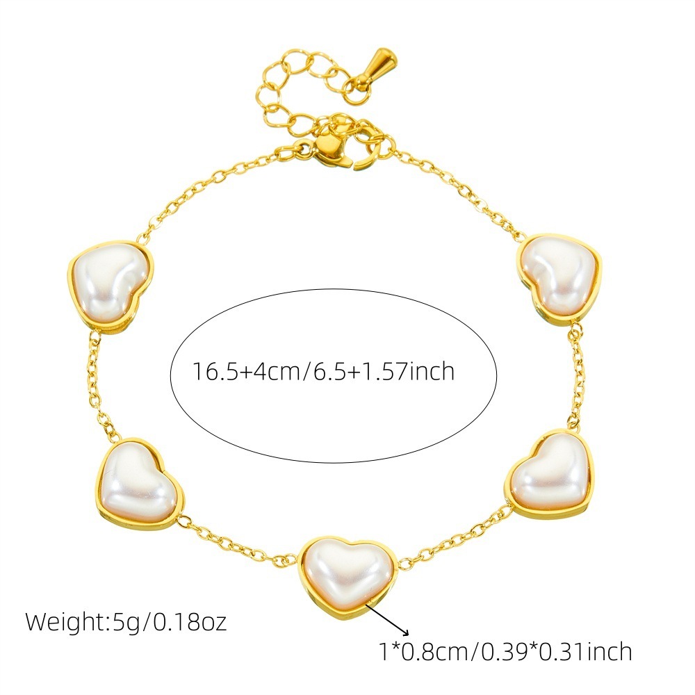 Stylish and minimalist French retro pearl heart gold-plated stainless steel O-chain bracelet, earrings, and necklace set.
