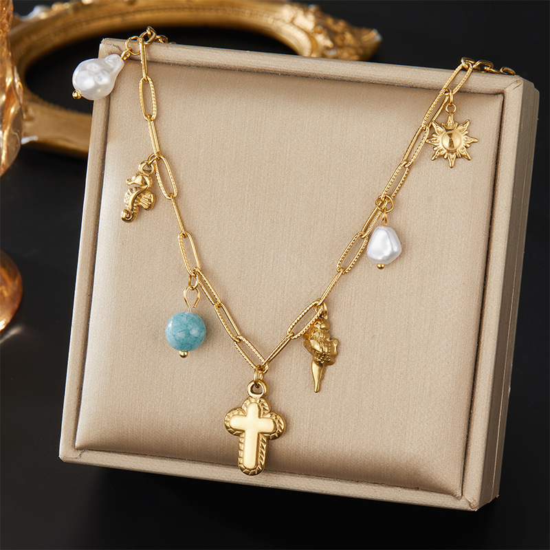 European and American retro oval logo pendant sweatshirt chain, versatile turquoise teardrop imitation pearl angel clavicle chain jewelry.